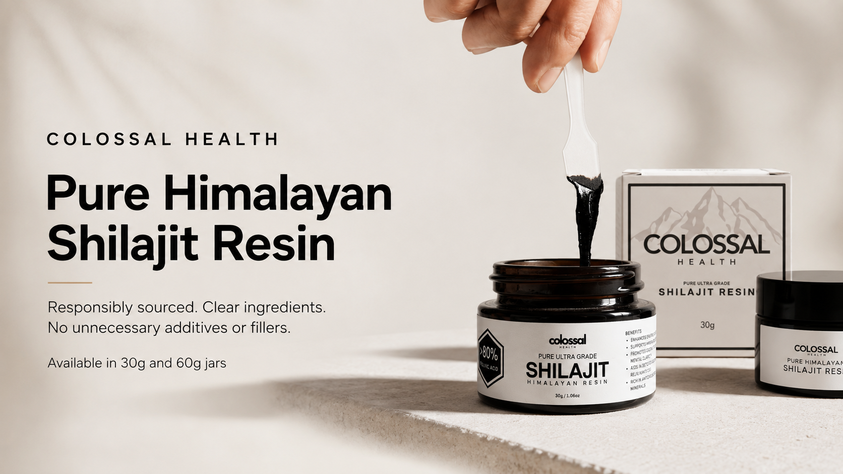 Colossal Health Pure Himalayan Shilajit Resin homepage banner showing open resin jars, product packaging and resin being lifted with a spatula